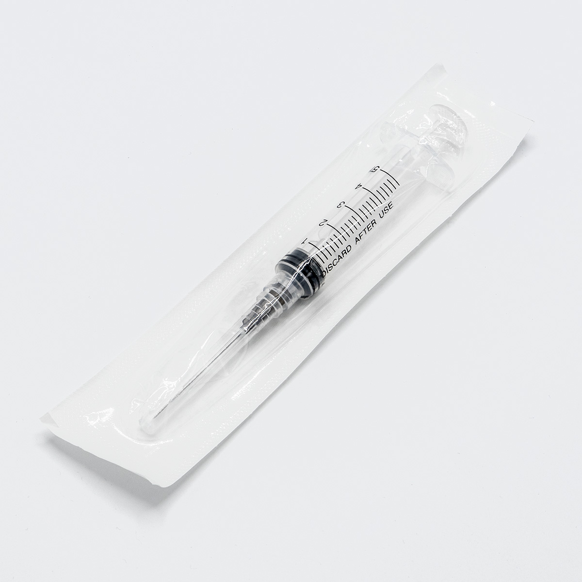 Injection syringes with pre-assembled needle